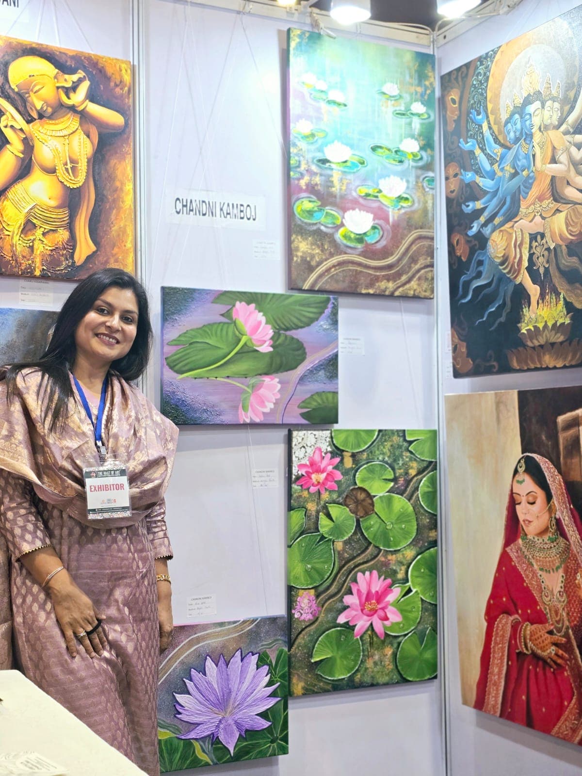 Visitors browsing paintings at The Naat of Art exhibition