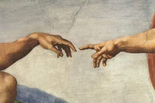 Close-up of two hands reaching toward each other, echoing Michelangelo's Creation of Adam